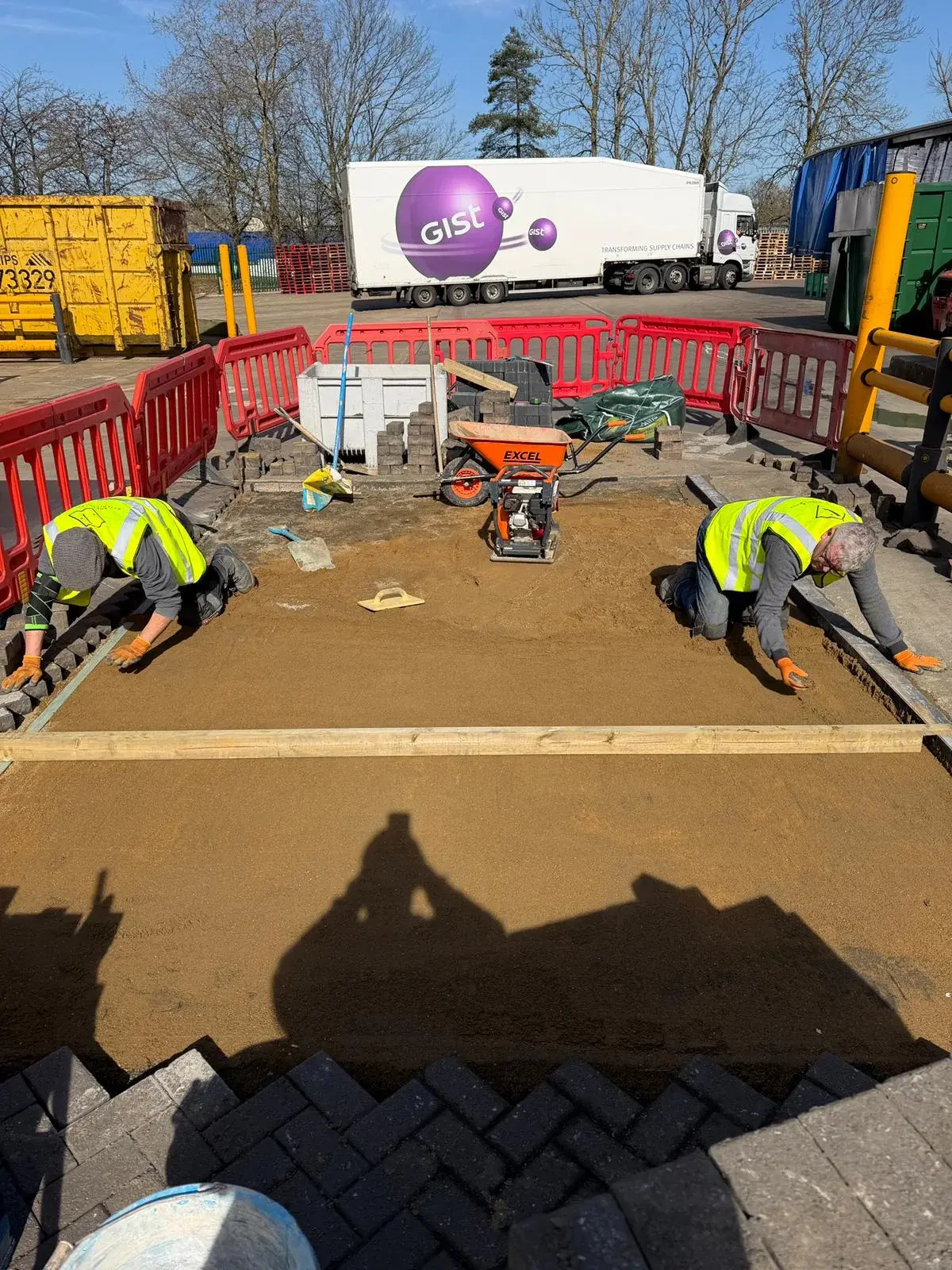 Sub-base sand screeding and compaction